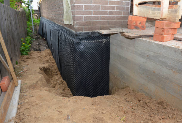 Happy homeowners after waterproofing job in Whitleyville